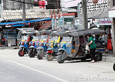Tuk tuks are stop in the line waiting for passengers at the roadside Editorial Stock Photo