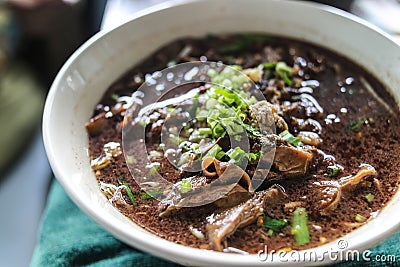 The noodle with pig blood soup mix with pork and vegetable Stock Photo