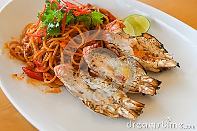 noodles plate with spaghetti pasta stir fried with vegetables herb spicy tasty appetizing asian noodles mix seafood stir fried Stock Photo