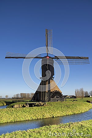 Noordeveldse windmill with a clear blue sky Stock Photo