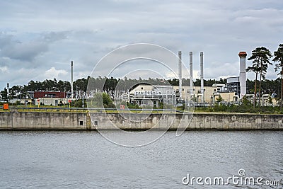 Nord stream landfall station in Lubmin near Greifswald at the port under a cloudy sky, gas pipeline through the Baltic Sea from Stock Photo