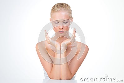 Nordic girl seated with join arms Stock Photo