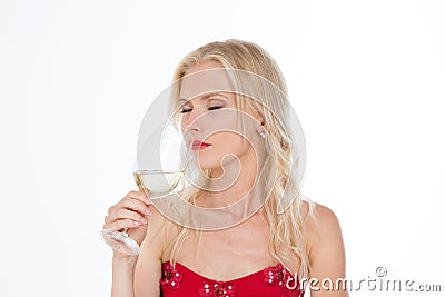 Nordic girl smelling a glass of white wine Stock Photo