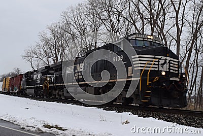 Norfolk Southern Train Traveling through Snow Editorial Stock Photo