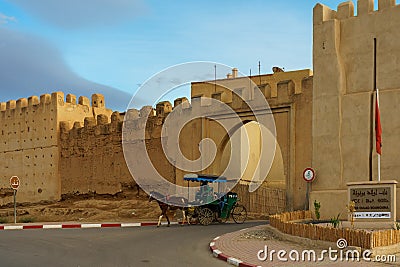 Morocco. Taroudant. A horse-drawn carriage past the city walls Editorial Stock Photo