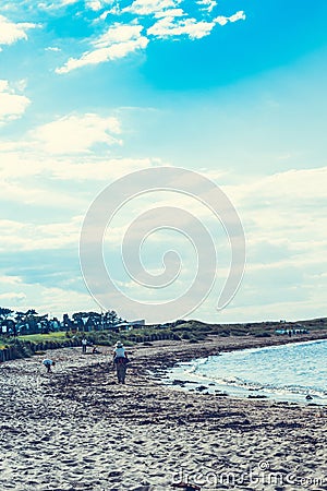 North Berwick beach and tourists walking on the sand, East Lothian Editorial Stock Photo