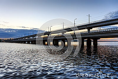 North Bridge - motor bridge in Voronezh city, Russia through the reservoir. Sunset, river or lake for copy space Stock Photo