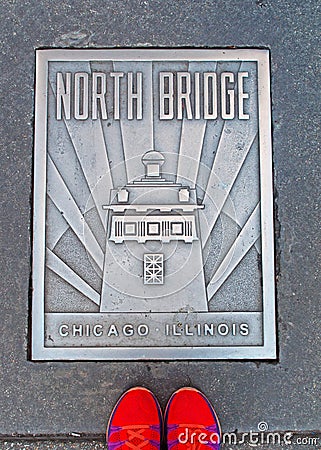 North Bridge plate on the street with a pair of shoes, Chicago Editorial Stock Photo