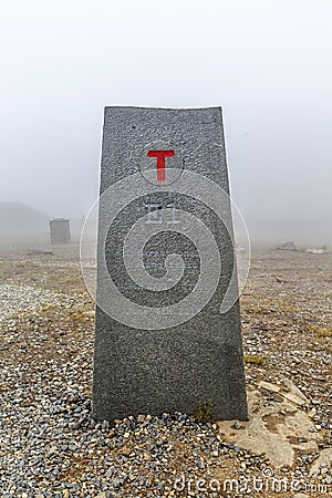 North Cape Nordkapp, on the northern coast of the island of Mageroya in Finnmark, Northern Norway on heavy foggy day . Stock Photo