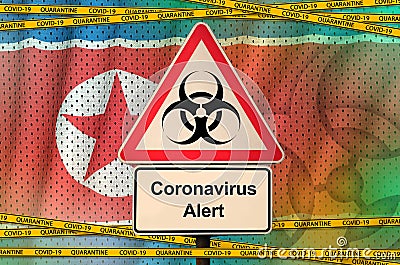 North Korea flag and Covid-19 biohazard symbol with quarantine orange tape. Coronavirus or 2019-nCov virus concept Stock Photo