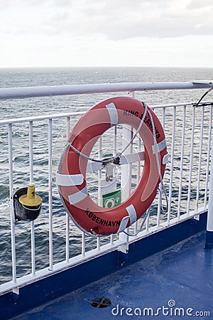 Lifesaver bouy on the railings at the side of a ship ferry Editorial Stock Photo