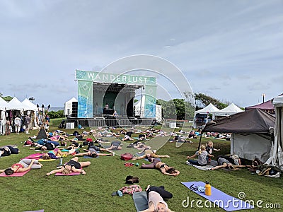 People stretch at Catch the Vision outdoor yoga class Editorial Stock Photo