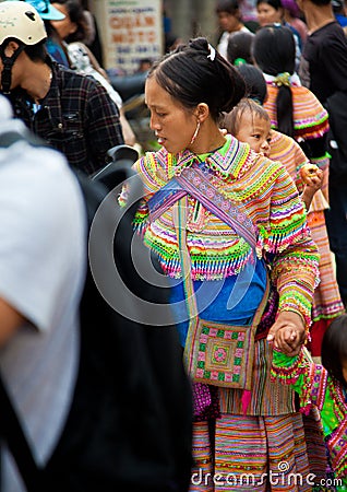 North Vietnamese woman in colorful native clothing with child on Editorial Stock Photo