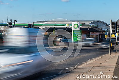 Northampton, UK - Feb 26, 2018: Day view of British Petroleum BP logo with traffic in motion blur in town center Editorial Stock Photo