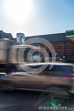 Northampton, UK - Feb 26, 2018: Day view of British Petroleum BP logo with traffic in motion blur in town center Editorial Stock Photo