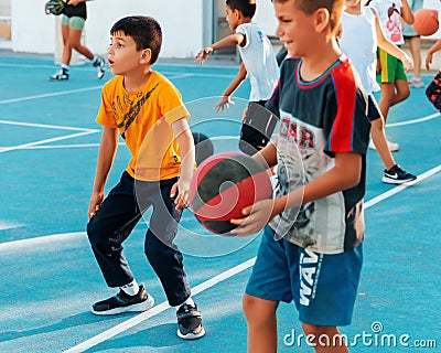 Northen Cyprus, Girne, Alsancak - Jule, 25, 2023: Basketball sports training for children teenagers around 7-14 years old. The Editorial Stock Photo