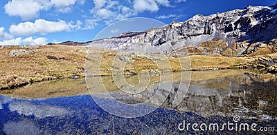 Northern flank of Troumouse circus reflecting in the lake surface Stock Photo