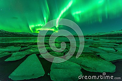 Northern lights (Aurora borealis) reflection across a lake in Iceland. Stock Photo