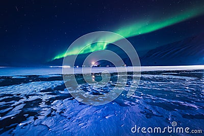 The Northern lights in the mountains of Svalbard, Longyearbyen, Spitsbergen, Norway wallpaper Stock Photo