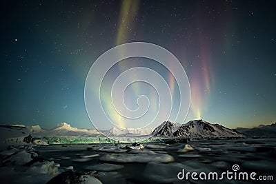 Northern Lights over the Arctic tidewater glacier - Spitsbergen, Svalbard Stock Photo