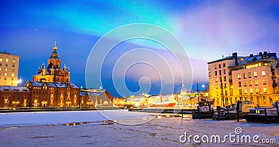 Northern lights over the frozen Old Port in Katajanokka district with Uspenski Orthodox Cathedral in Helsinki Finland Stock Photo