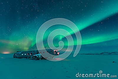 Northern lights over plane wreck on the wreck beach in Vik, Iceland Stock Photo
