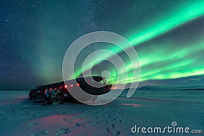 Northern lights over plane wreck on the wreck beach in Vik, Iceland Stock Photo