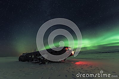 Northern lights over plane wreck on the wreck beach in Vik, Iceland Stock Photo