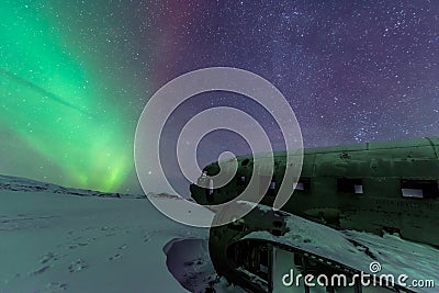 Northern lights over plane wreck on the wreck beach in Vik, Iceland Stock Photo