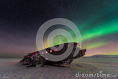 Northern lights over plane wreck on the wreck beach in Vik, Iceland Stock Photo