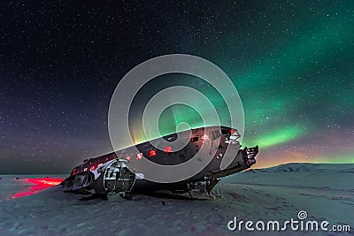 Northern lights over plane wreck on the wreck beach in Vik, Iceland Stock Photo