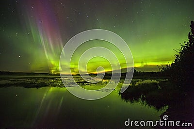 Northern lights over Watson Lake in Alaska Stock Photo
