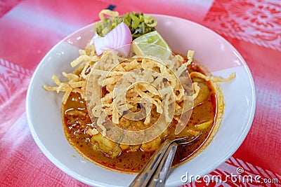 Northern Thai Cuisine with spicy curry soup topping with Lemon, Pickled, Lettuce Stock Photo