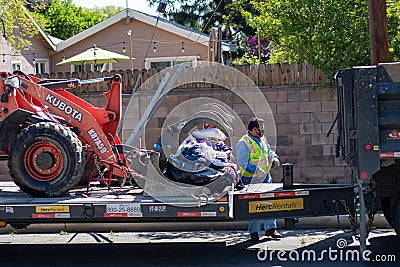 A City of Los Angeles Sanitation department employee loads illegally dumped abandoned bulk refus Editorial Stock Photo
