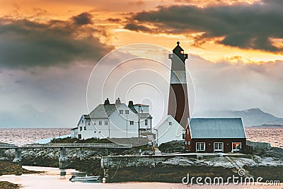 Norway Landscape Tranoy Lighthouse at sunset sea and mountains on background Travel Editorial Stock Photo