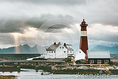 Norway Landscape Tranoy Lighthouse at sunset sea and mountains on background Travel Stock Photo