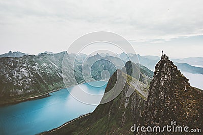 Norway mountain travel man standing on cliff edge Stock Photo