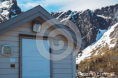 Norway rorbu houses and mountains rocks over fjord landscape scandinavian travel view Lofoten islands. Natural scandinavian Stock Photo