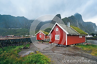 Norway village Reine near the scenic mountains and green water Stock Photo