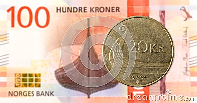 20 norwegian coin against new 100 norwegian krone bank note Stock Photo