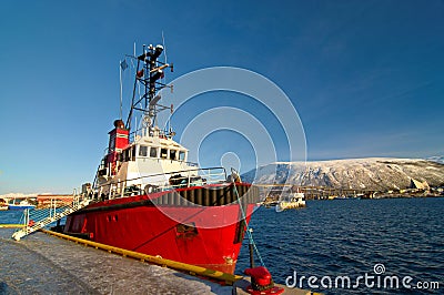 Norwegian fishing boat parked in a harbor in Tromso, city in northern Norway. Stock Photo