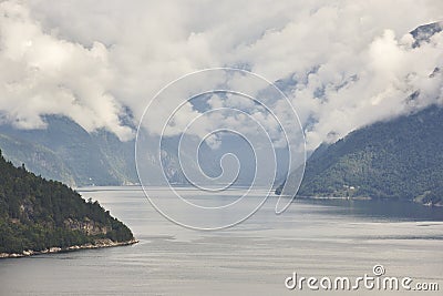 Norwegian fjord landscape with mountains and clouds. Sorfjorden. Norway. Stock Photo