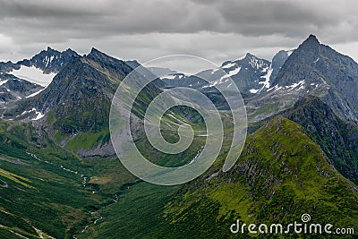 Norwegian mountains with famous Slogen mountain with dark clouds Stock Photo