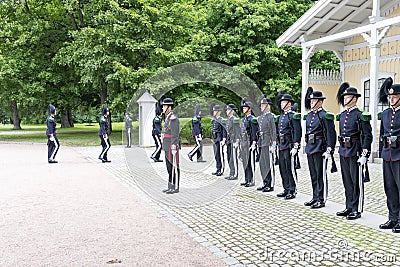 Norwegian soldiers in gala uniforms changing honor guard in front of the Royal Palace on July 1, 2016 in Oslo, Norway. Editorial Stock Photo