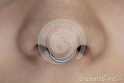 Nose piercing septum. Stock Photo