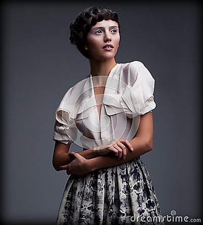 Nostalgia. Exquisite Styled woman in Retro Apparel with Stylish Braided Hair Style Stock Photo