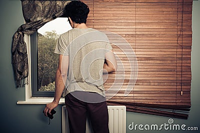 Nosy neighbour with binoculars Stock Photo