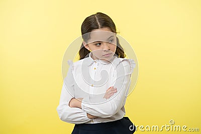 That is not fair. Pupil not agree with mark. Girl serious face offended yellow background. Kid unhappy looks strictly Stock Photo