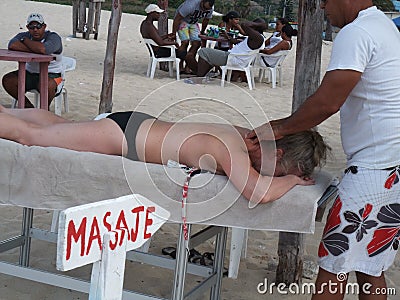 Massage on a Cuba beach Editorial Stock Photo