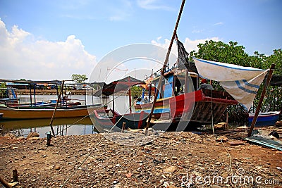 Fishing boats that are sitting on the shore, Stock Photo